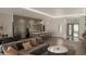 Open-concept living and dining area featuring hardwood floors, modern lighting, and stylish furniture at 15945 Viscount Cir, Port Charlotte, FL 33981