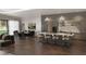 Open-concept kitchen with stainless steel appliances, large island, hardwood floors, and ample seating at 15945 Viscount Cir, Port Charlotte, FL 33981