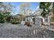 A well maintained backyard with a hot tub, screened pool, and a storage shed at 4721 Country Manor Dr, Sarasota, FL 34233