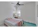 Bright bedroom with a fan, soft colors and a large window for plenty of natural light at 4721 Country Manor Dr, Sarasota, FL 34233