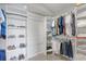 Spacious walk-in closet with built in shelving for clothing and storage at 4721 Country Manor Dr, Sarasota, FL 34233