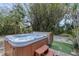 A lovely hot tub in a tropical backyard oasis with privacy and a peaceful setting at 4721 Country Manor Dr, Sarasota, FL 34233