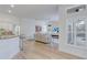 Bright living room with open layout, wood floors, and white plantation shutters for natural light at 4721 Country Manor Dr, Sarasota, FL 34233