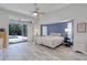 Spacious main bedroom with pool view, sliding glass doors, and recessed ceiling at 4721 Country Manor Dr, Sarasota, FL 34233