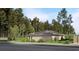View of the home, including three-car garage, sidewalk, and mature landscaping at 8073 Antwerp Cir, Port Charlotte, FL 33981