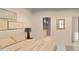 Sunlit main bedroom featuring a walk-in closet and an ensuite bathroom at 8073 Antwerp Cir, Port Charlotte, FL 33981