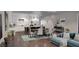 Open-concept kitchen and living area with modern finishes, stylish lighting, and comfortable seating at 8259 Tracy Cir, Port Charlotte, FL 33981