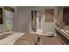 Serene main bedroom with a view to the bathroom and TV, offering a relaxing retreat at 8259 Tracy Cir, Port Charlotte, FL 33981
