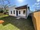Fenced backyard with green grass, offering a private and secure outdoor space at 2604 E 11Th Ave, Tampa, FL 33605