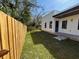 Fenced backyard with green grass, offering a private and secure outdoor space at 2604 E 11Th Ave, Tampa, FL 33605