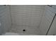Updated bathroom with stylish hexagon tile floor and contemporary shower design at 2604 E 11Th Ave, Tampa, FL 33605