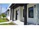 Close-up of home's modern facade and landscaping at 2604 E 11Th Ave, Tampa, FL 33605