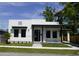 Charming single-story home with modern design elements, manicured lawn, and inviting entrance at 2604 E 11Th Ave, Tampa, FL 33605