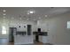 Open-concept kitchen with stainless steel appliances, granite counters, and a center island at 2604 E 11Th Ave, Tampa, FL 33605