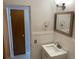 Bathroom features a white marble vanity and a framed mirror, alongside a convenient towel rack at 4143 57Th N St # 502, Kenneth City, FL 33709