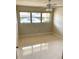 Bright bedroom with a large window and neutral walls at 4143 57Th N St # 502, Kenneth City, FL 33709