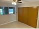 Cozy bedroom featuring a window for natural light and a closet for ample storage at 4143 57Th N St # 502, Kenneth City, FL 33709