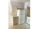 Well-organized kitchen area with ample storage, cabinets, and modern refrigerator at 4143 57Th N St # 502, Kenneth City, FL 33709