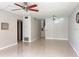 Spacious living room featuring neutral colors, a ceiling fan and tiled floors at 4143 57Th N St # 502, Kenneth City, FL 33709