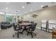 The meeting room features a large table, leather chairs, and lots of space at 750 4Th S Ave # 601H, St Petersburg, FL 33701