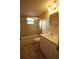 Bathroom with neutral tile, shower with glass doors, and white vanity at 6026 22Nd N Ave # 4, St Petersburg, FL 33710