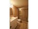 Updated bathroom features a glass enclosed shower, sink and toilet at 6026 22Nd N Ave # 4, St Petersburg, FL 33710
