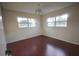 Bright bedroom featuring wood floors and dual windows, offering ample natural light at 6026 22Nd N Ave # 4, St Petersburg, FL 33710