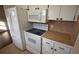 Well-equipped kitchen featuring white appliances and ample cabinet space at 6026 22Nd N Ave # 4, St Petersburg, FL 33710