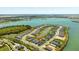 Picturesque aerial perspective of the neighborhood, featuring waterfront homes along a tranquil lake and well-maintained streets at 16397 Preservation Blvd, Punta Gorda, FL 33982