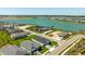 Beautiful aerial view showcasing the pristine landscaping and waterfront homes of the neighborhood, with the lake as a backdrop at 16397 Preservation Blvd, Punta Gorda, FL 33982