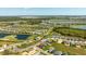 Expansive aerial view of the community, showcasing lush landscaping, serene lakes, and meticulously planned residential areas at 16397 Preservation Blvd, Punta Gorda, FL 33982