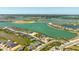 Scenic aerial shot capturing the community's layout, with modern homes nestled alongside sparkling lakes and verdant green spaces at 16397 Preservation Blvd, Punta Gorda, FL 33982