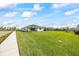 A home with a spacious lawn and tidy landscaping, ideal for outdoor enjoyment and curb appeal at 16397 Preservation Blvd, Punta Gorda, FL 33982