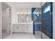 Elegant primary bathroom featuring double sinks, sleek fixtures, and a large glass shower at 16397 Preservation Blvd, Punta Gorda, FL 33982