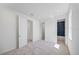 Bright bedroom featuring carpeted floors and access to bathroom and closet spaces at 16397 Preservation Blvd, Punta Gorda, FL 33982