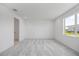 Bright bedroom with plush carpeting and a window offering scenic outdoor views at 16397 Preservation Blvd, Punta Gorda, FL 33982