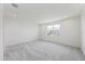 Spacious, bright bedroom with large window and neutral carpeting throughout the home at 16397 Preservation Blvd, Punta Gorda, FL 33982