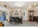 Bright dining area with tile floors, dining table and chairs, open to kitchen at 1768 Suffolk Dr, Clearwater, FL 33756