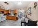 Open kitchen and dining area with tile floors, wood cabinets and stainless steel appliances at 1768 Suffolk Dr, Clearwater, FL 33756