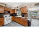 Charming kitchen with wood cabinets, modern appliances, and tile flooring at 1768 Suffolk Dr, Clearwater, FL 33756