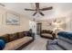 Relaxing living room space featuring tile floors, ample seating, and neutral wall paint at 1768 Suffolk Dr, Clearwater, FL 33756