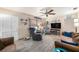 Cozy living room featuring tile floors, neutral decor, and comfortable seating arrangement at 1768 Suffolk Dr, Clearwater, FL 33756