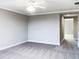 Bedroom with a ceiling fan, carpet, crown moulding, and an adjoining entranceway at 6113 Shadowlake Dr, Apollo Beach, FL 33572