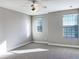 Bedroom with carpet flooring and two windows providing natural light, plus a ceiling fan at 6113 Shadowlake Dr, Apollo Beach, FL 33572