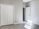 Empty bedroom featuring tile floors and closet at 6113 Shadowlake Dr, Apollo Beach, FL 33572