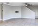 Bright, open living space with tile flooring, recessed lighting, and neutral wall color at 6113 Shadowlake Dr, Apollo Beach, FL 33572