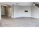 Expansive living area with tile flooring, archway to entry, ceiling fan, and neutral wall colors at 6113 Shadowlake Dr, Apollo Beach, FL 33572