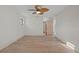 Bright, spacious bedroom with wood floors and a modern ceiling fan for added comfort at 12467 94Th Ave, Seminole, FL 33772