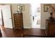 Bedroom showcasing hardwood floors with a bathroom view and neutral walls at 5011 88Th E St, Bradenton, FL 34211