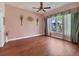 Large bedroom with hardwood floors and plenty of natural light coming through the window at 5011 88Th E St, Bradenton, FL 34211